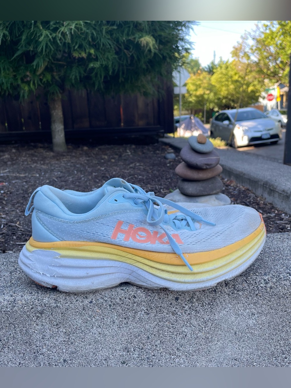 Blue and yellow Hoka One One Bondi 8 running shoes women’s 9D